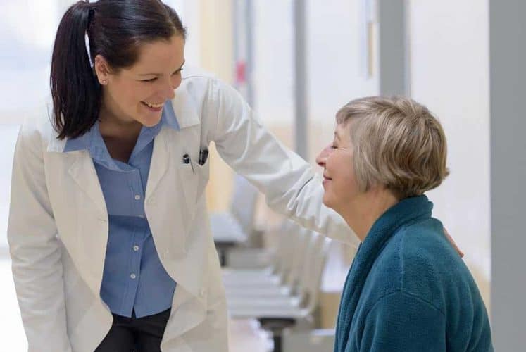 doctor with patient in hospital or medical office